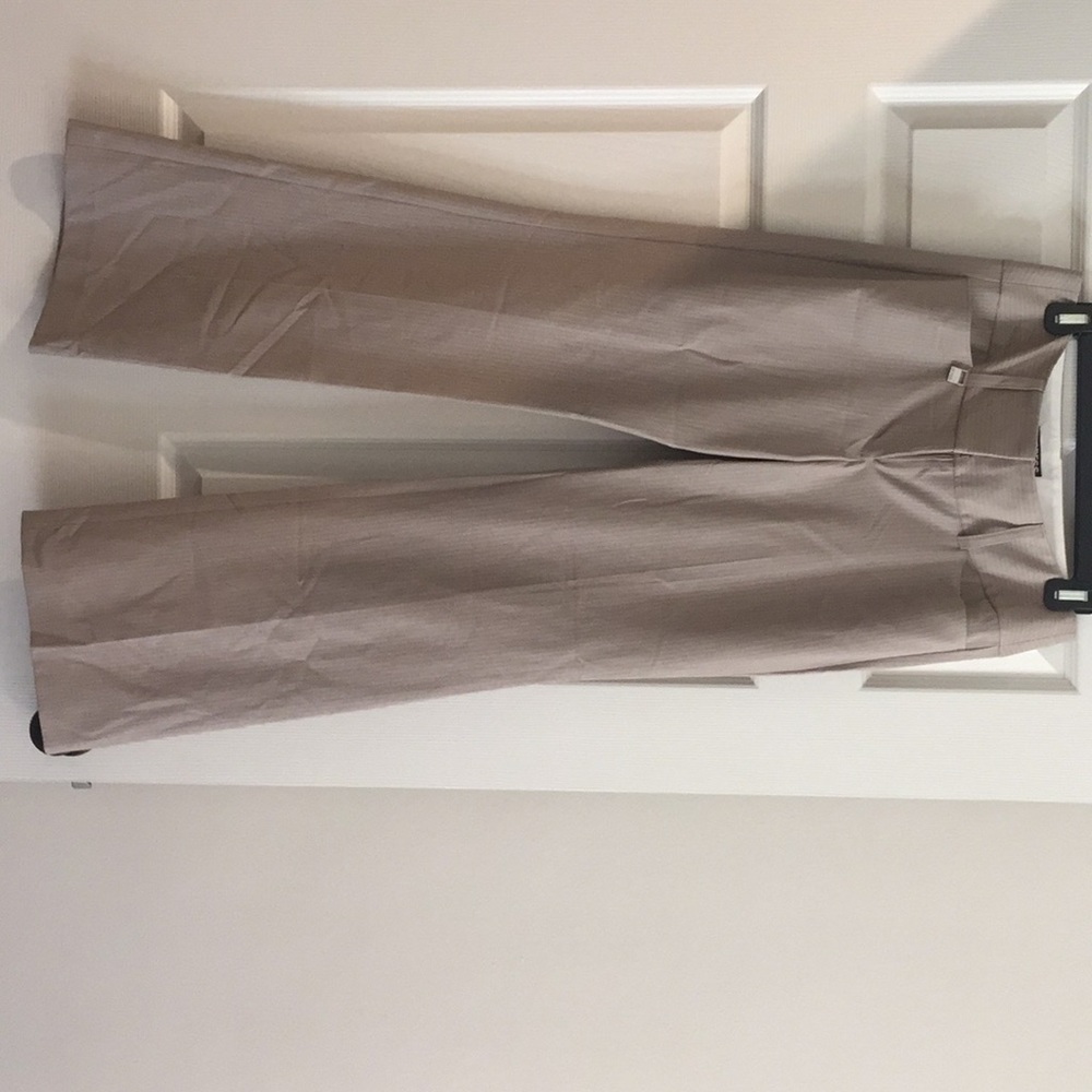 Beige pinstripe pants.